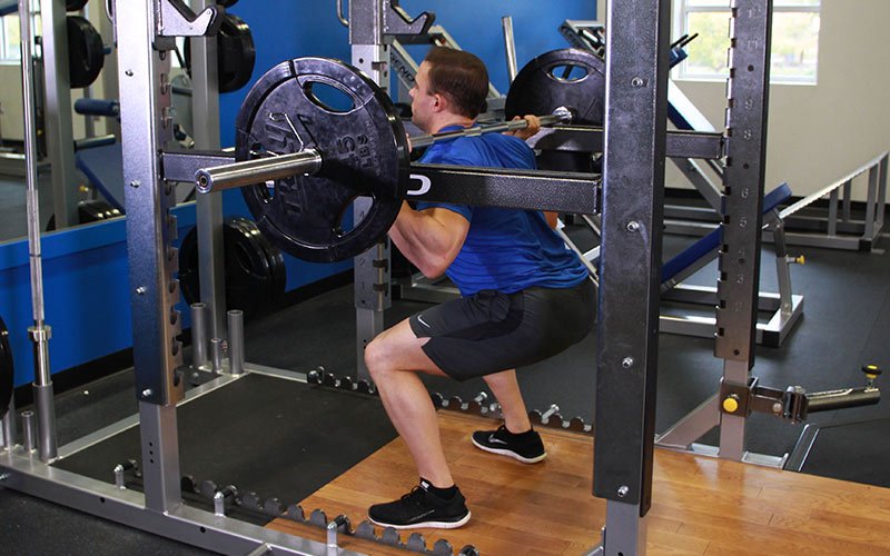 using pins to boost squat