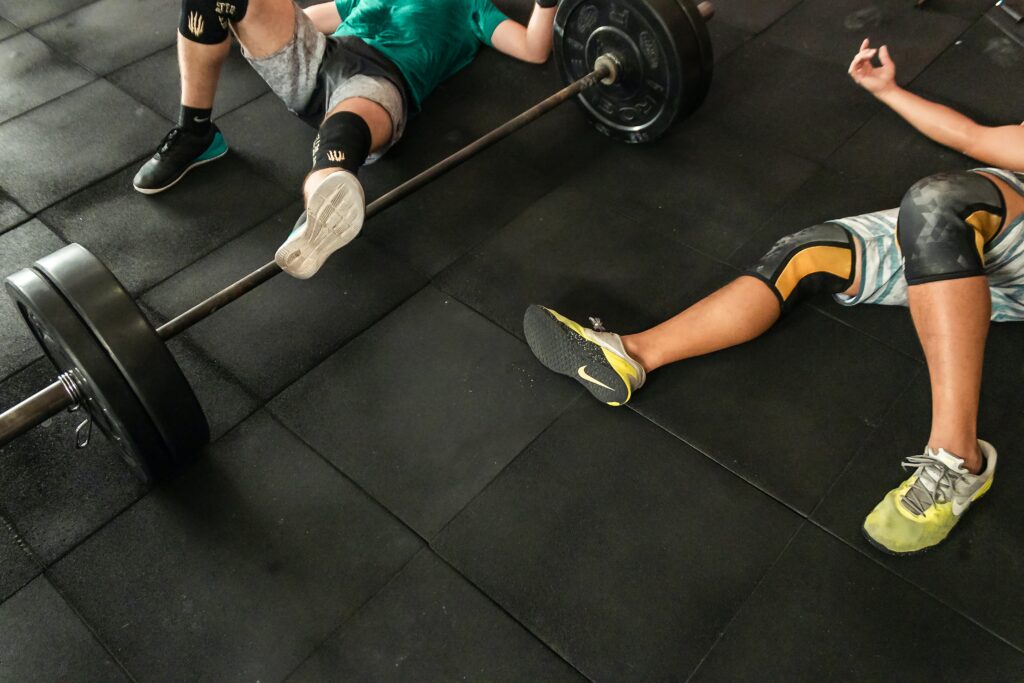 Some men exhausted after a weightlifting based cardio session